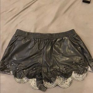 Leather shorts with cut out design along bottom M